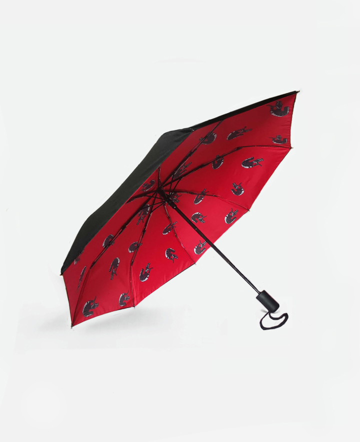 Folding umbrella with a symbol of orisha Eshu with automatic opening and closing.